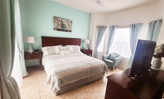 bedroom featuring light tile patterned floors and ceiling fan