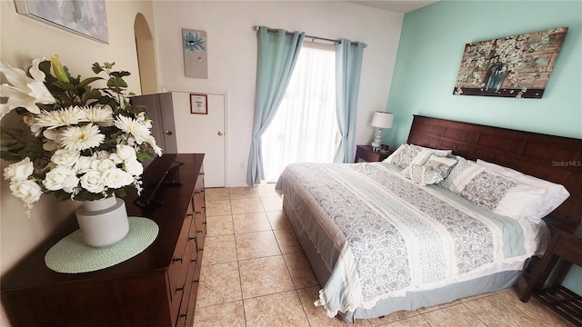 bedroom featuring light tile patterned floors