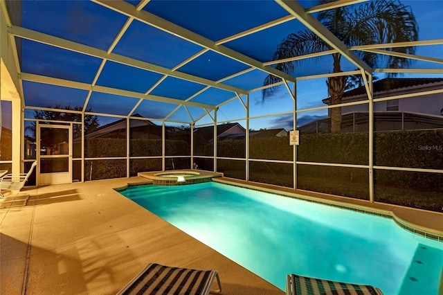 view of swimming pool featuring an in ground hot tub, a lanai, and a patio area