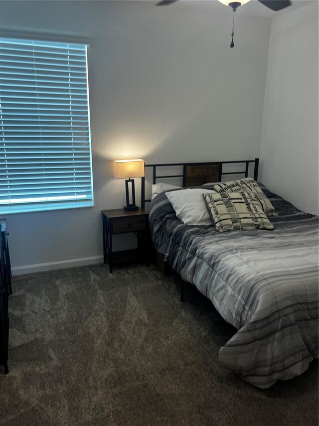 bedroom with ceiling fan and carpet flooring