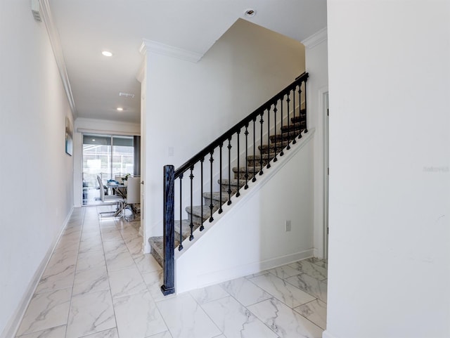 staircase featuring ornamental molding