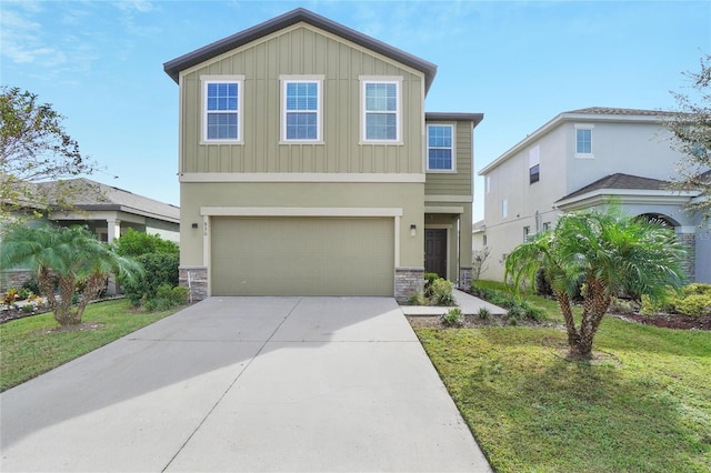 view of front of home with a front lawn and a garage