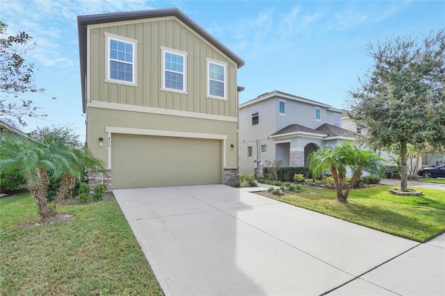 view of front of property with a garage and a front yard