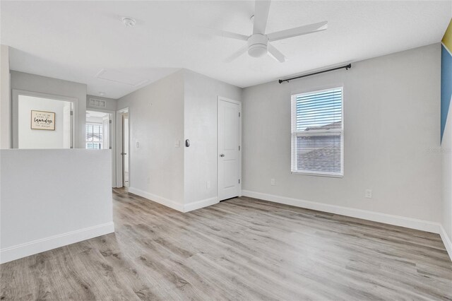 spare room with ceiling fan and light hardwood / wood-style flooring