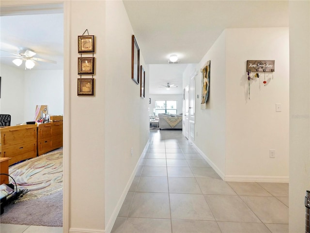 corridor with light tile patterned floors