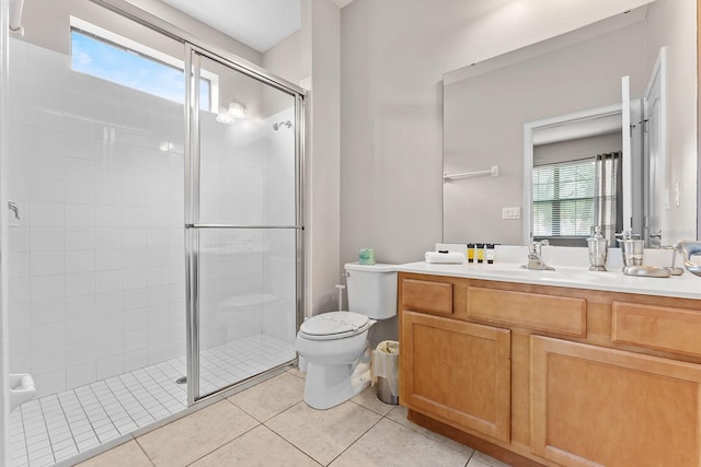 bathroom featuring walk in shower, tile patterned flooring, toilet, and vanity