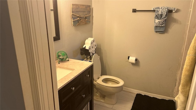 bathroom featuring vanity, toilet, and tile patterned floors