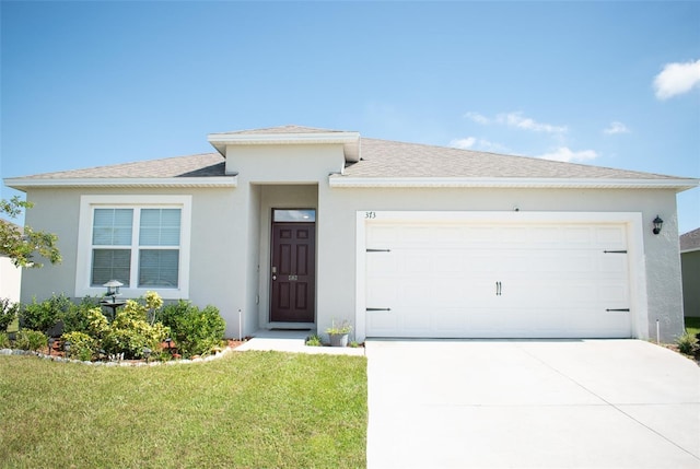 view of front facade with a garage and a front yard