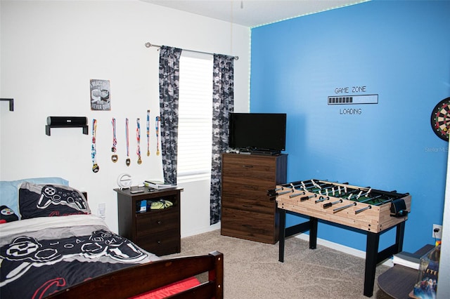 bedroom featuring light colored carpet