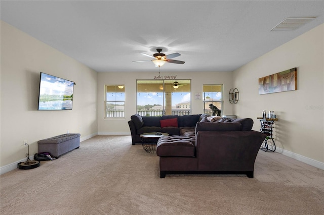 living room featuring ceiling fan and light carpet