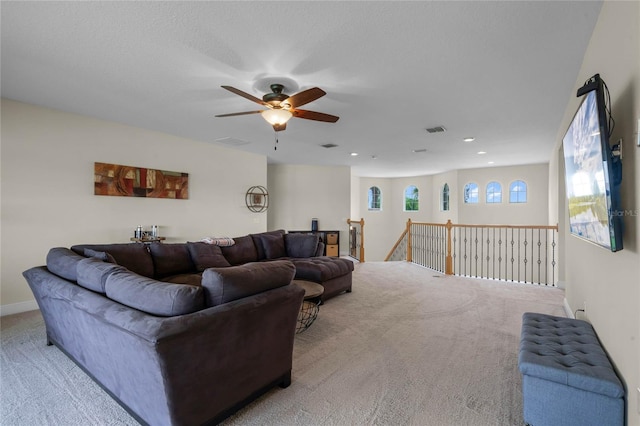 living room with ceiling fan and light carpet