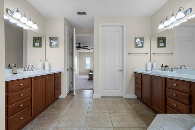 bathroom featuring ceiling fan, tile patterned flooring, and vanity