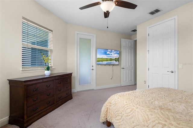 carpeted bedroom featuring ceiling fan