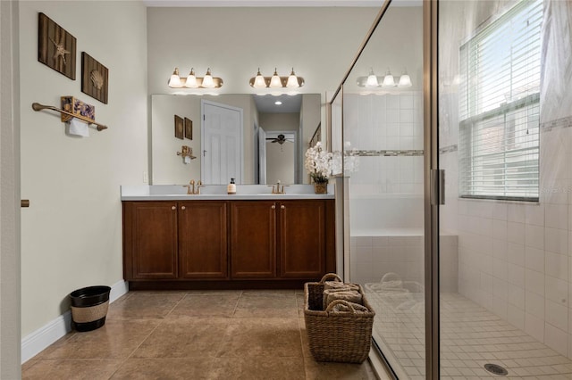 bathroom featuring vanity, tile patterned flooring, a healthy amount of sunlight, and a shower with door