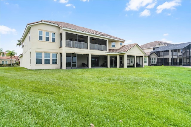 back of house featuring a lawn