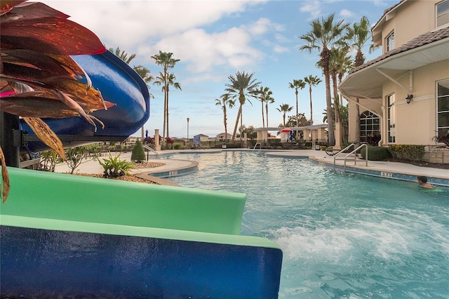 view of swimming pool featuring a water slide