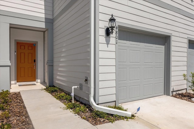 doorway to property featuring a garage