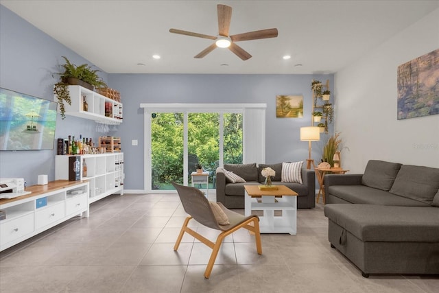 living room featuring tile patterned flooring, a ceiling fan, and recessed lighting