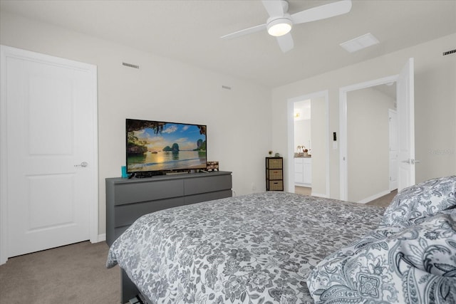 carpeted bedroom featuring ceiling fan, visible vents, and baseboards