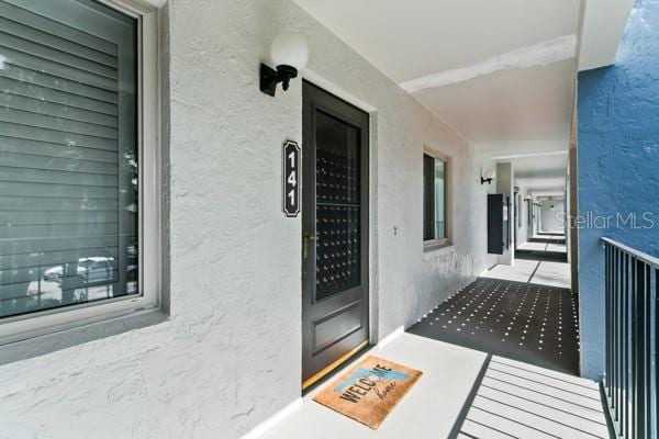 doorway to property featuring a balcony