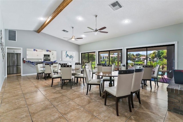 tiled dining area with beam ceiling, high vaulted ceiling, and a textured ceiling