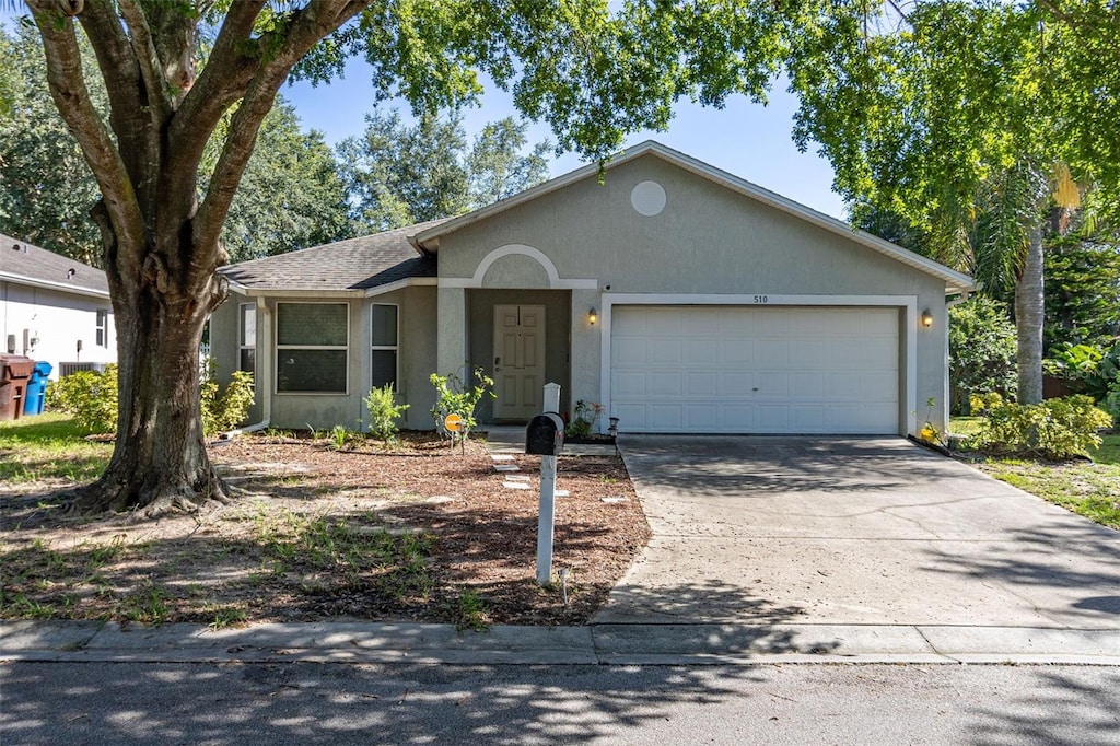 single story home featuring a garage