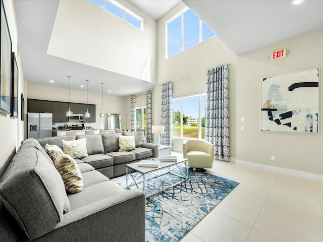 tiled living room with a towering ceiling