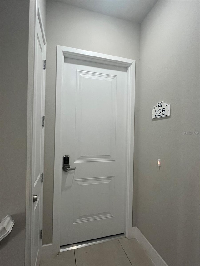 doorway featuring tile patterned flooring