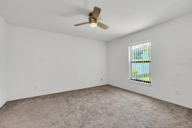 unfurnished room with light carpet and ceiling fan