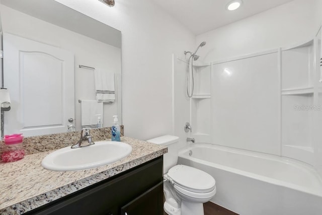 full bathroom featuring vanity, bathtub / shower combination, and toilet