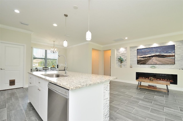 kitchen with sink, stainless steel dishwasher, an island with sink, decorative light fixtures, and white cabinets