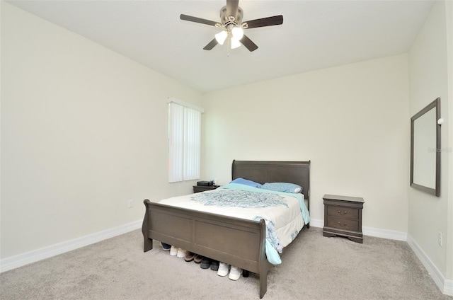 bedroom with ceiling fan and light colored carpet