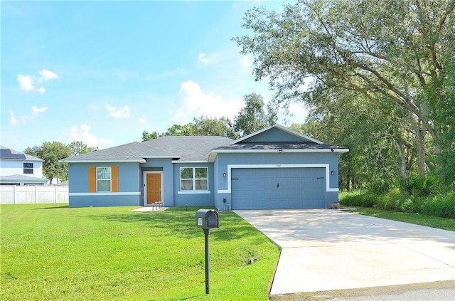 ranch-style home featuring a front lawn and a garage