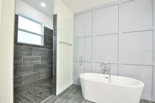 bathroom with separate shower and tub