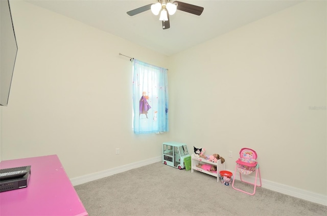 playroom featuring ceiling fan and light colored carpet