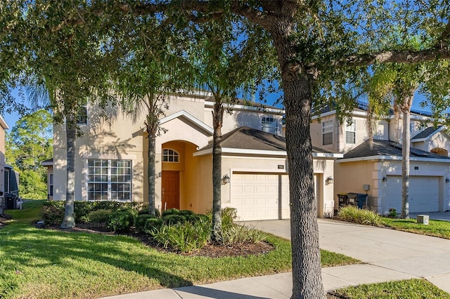 view of front of house with a garage and a front yard