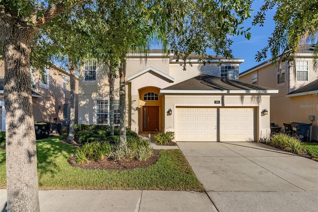 view of front of house with a garage and a front yard