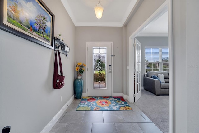 tiled entrance foyer with crown molding