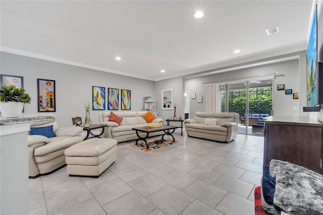 living room featuring ornamental molding and light tile patterned floors