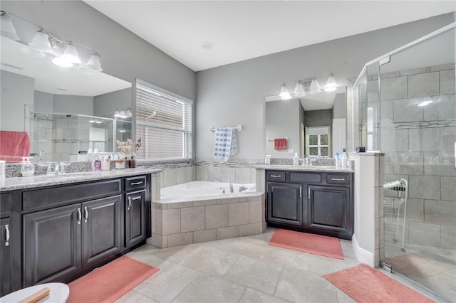 bathroom featuring vanity, tile patterned floors, and shower with separate bathtub