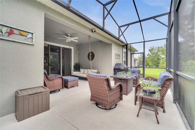 sunroom featuring ceiling fan