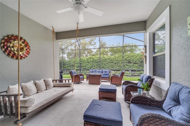 sunroom / solarium with ceiling fan