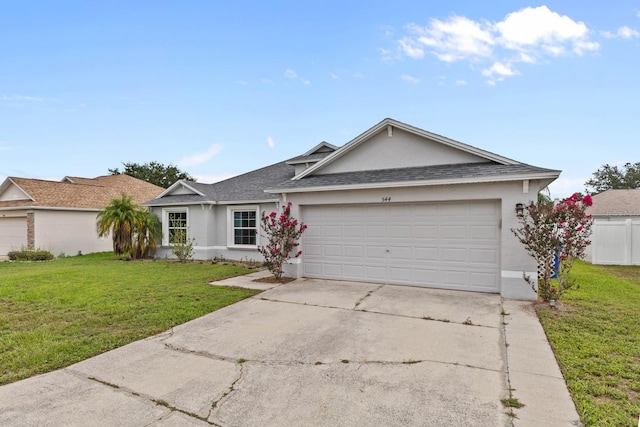 ranch-style house featuring a front yard and a garage