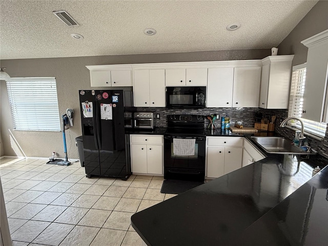 kitchen featuring white cabinetry, sink, and black appliances