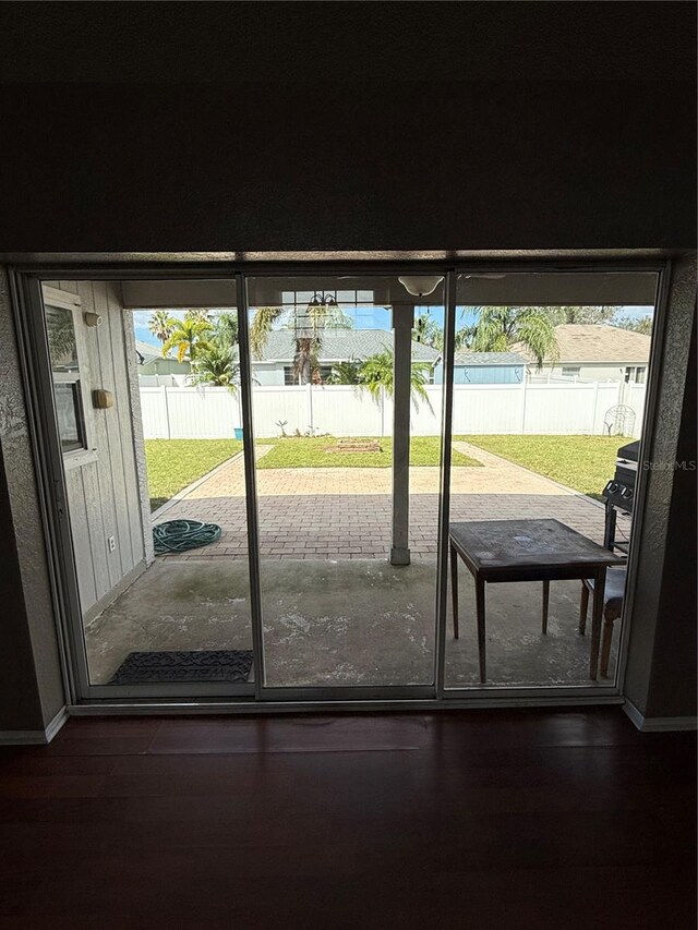 doorway featuring dark hardwood / wood-style floors