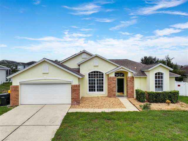 ranch-style house with a garage and a front yard