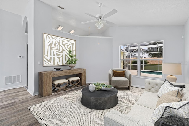 living room with lofted ceiling, ceiling fan, and hardwood / wood-style flooring