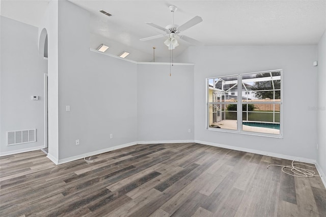 unfurnished room featuring lofted ceiling, hardwood / wood-style floors, and ceiling fan