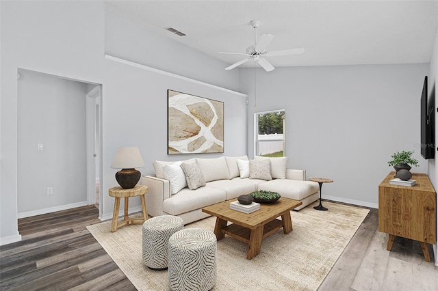 living room with high vaulted ceiling, ceiling fan, and wood-type flooring