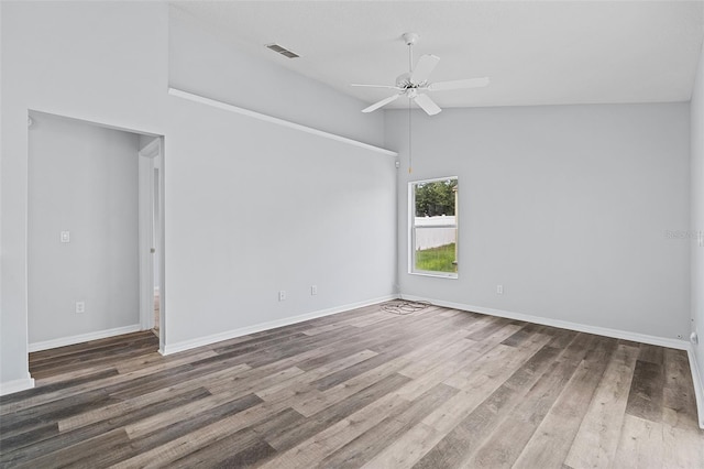 spare room with high vaulted ceiling, ceiling fan, and wood-type flooring